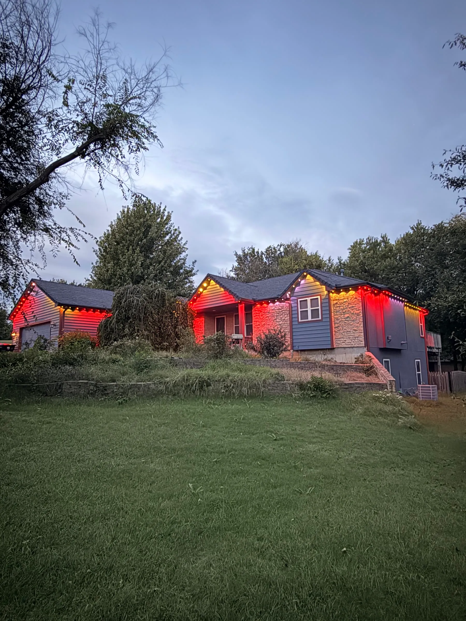 Permanent lights in red on a ranch at dusk