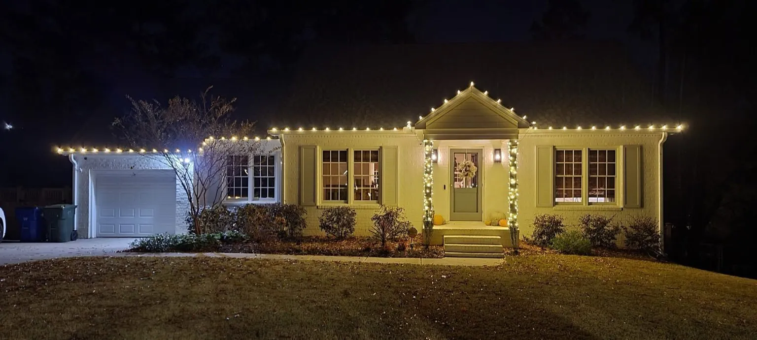 Residential roofline holiday lighting installed by RM Lighting Solutions