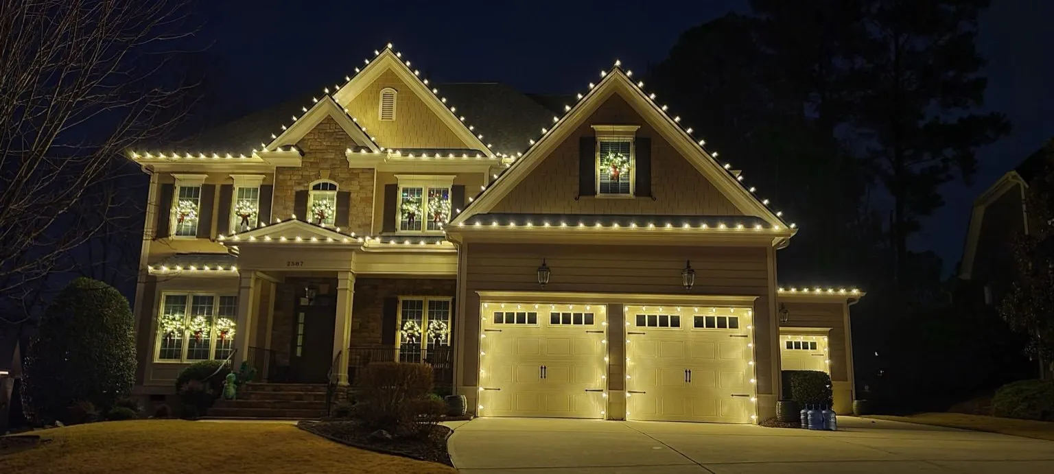 Residential roofline holiday lighting installed by RM Lighting Solutions